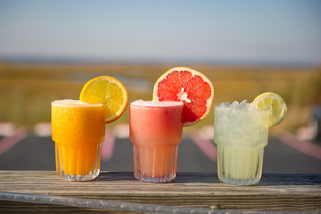 three different types of drinks sitting on a table