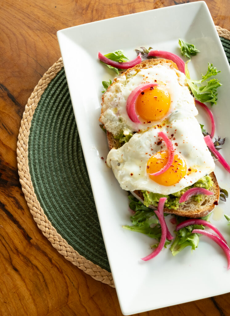 a plate of food on a wooden table