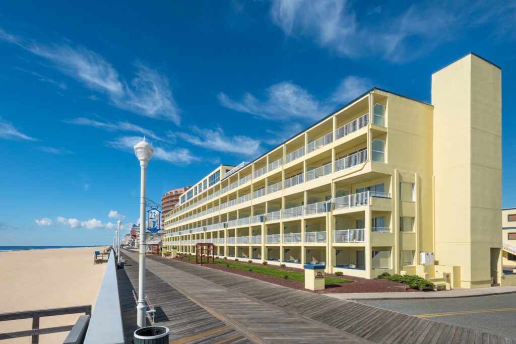 a hotel on the beach next to the ocean