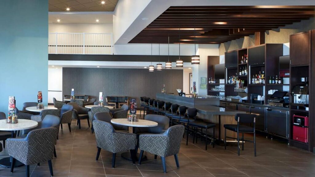 Coffee to cocktails bar at Hyatt Place Ocean City with lounge seating and bar area